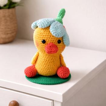 Küken mit Blumenhut